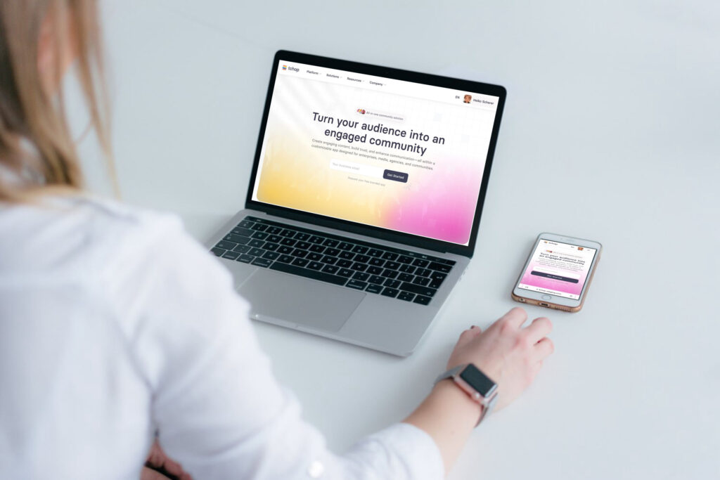Women sitting in front of new tchop website at a pc desk